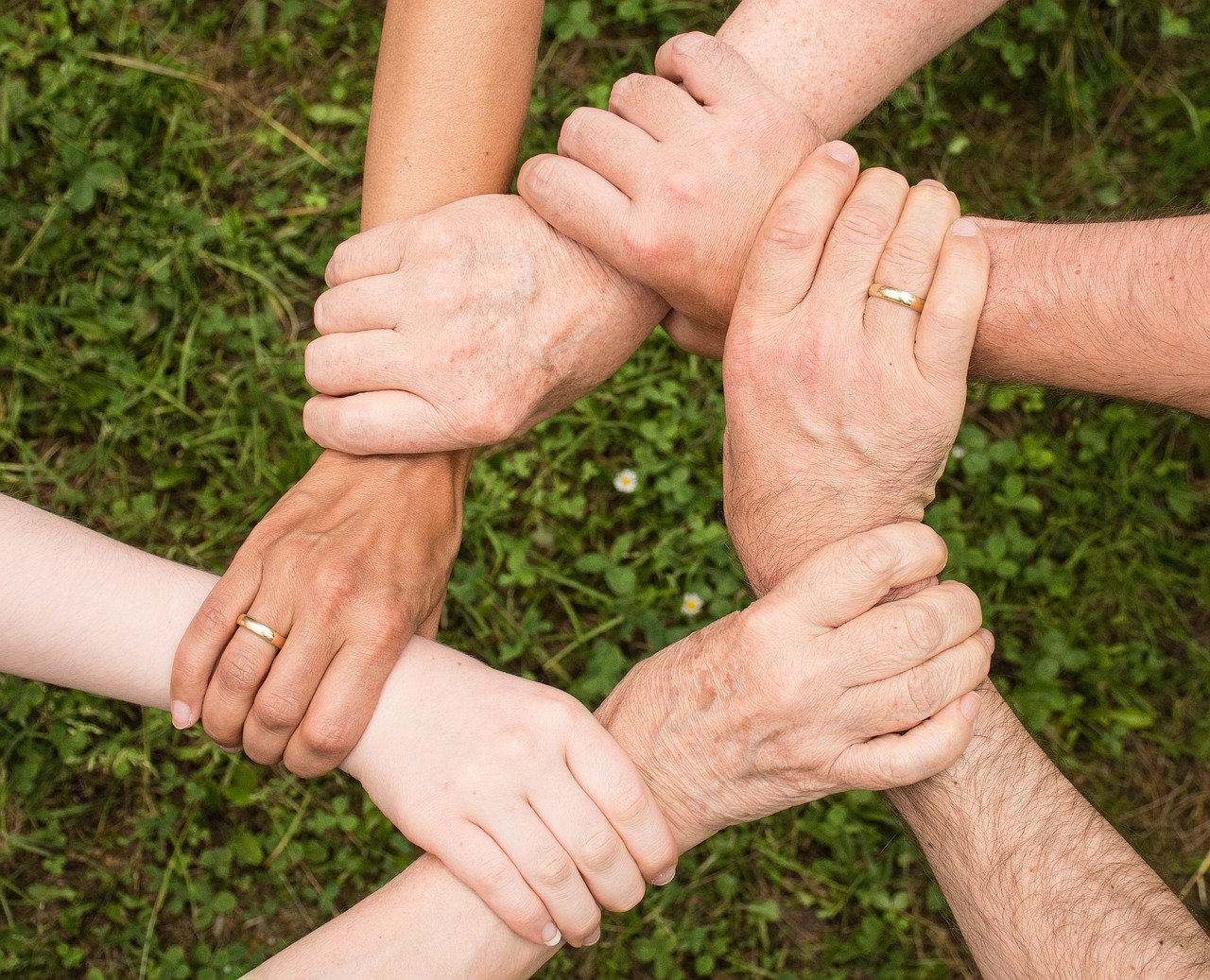holding a senior's hand